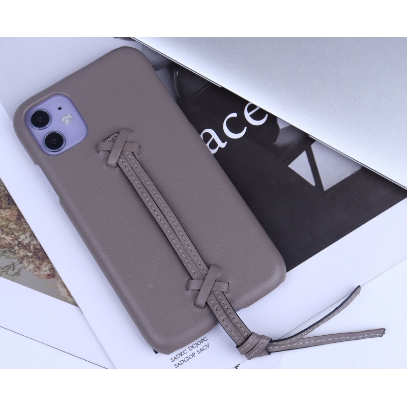Denieuwe Apple iPhone 15 Minimalistische Solid Color Echt lederen telefoonhoesje heeft een volledige lederen band draagtas en een 360 graden volledige wrap anti -val en botsing telefoonhoes